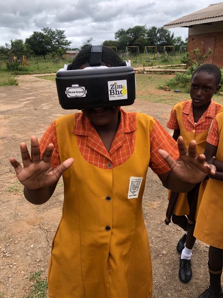 A student reaching out while wearing a Flexie VR headset