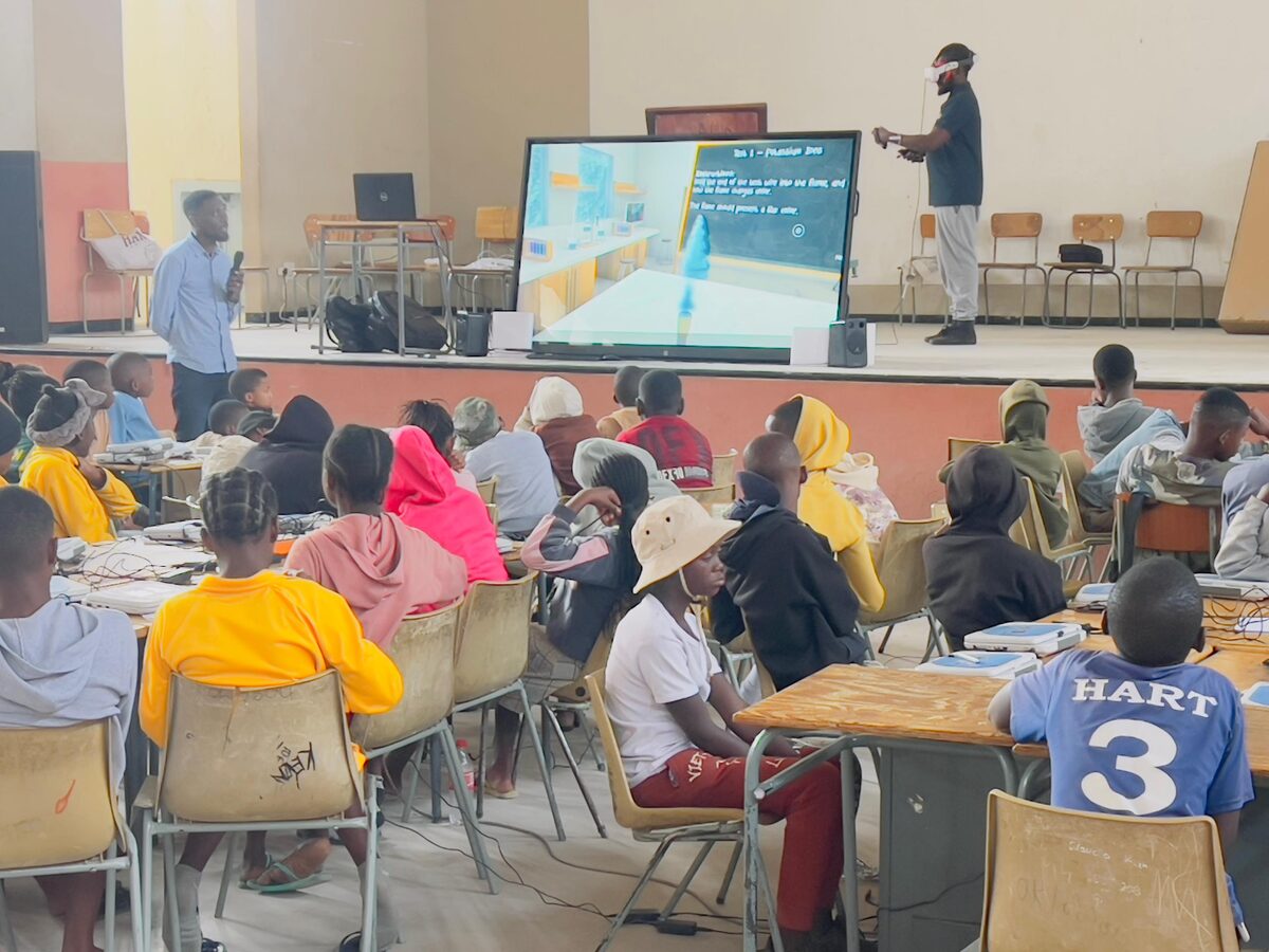 A visitor exploring a Flexie virtual field trip at an event